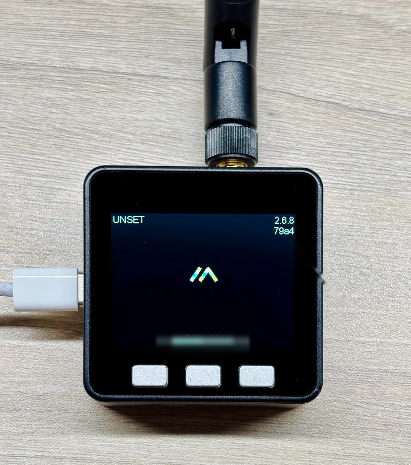 Compact square mesh node with a colour screen and three front buttons