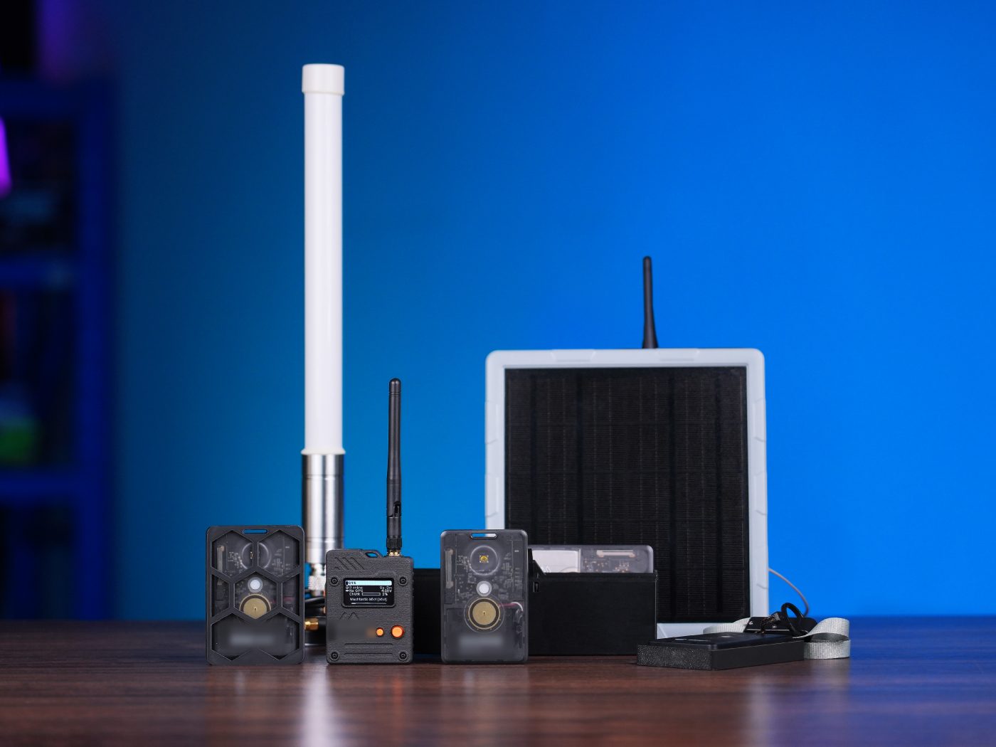 The Meshtastic India tracker and node range — cased trackers, a display node, high-gain antennas and a solar panel